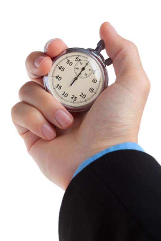 A hand holds a stopwatch A hand holds a stopwatch